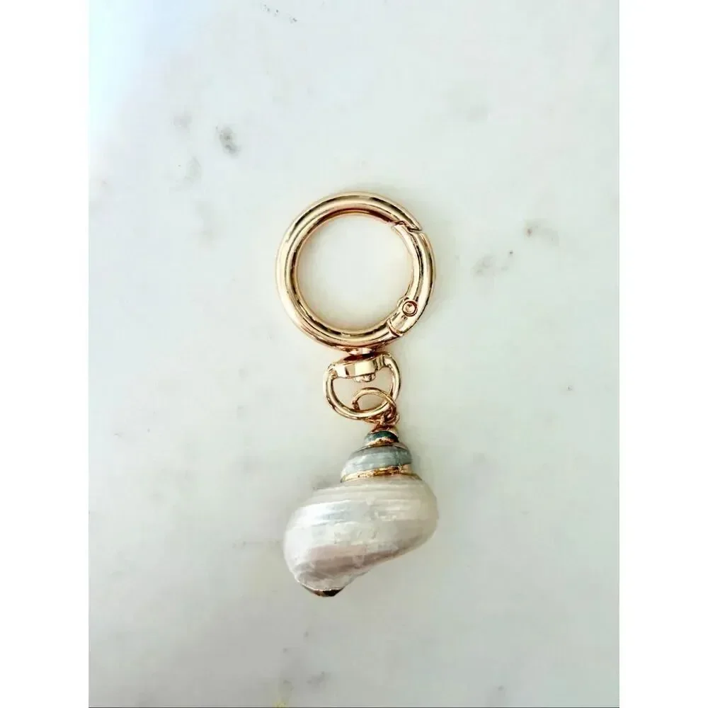 Pearlescent with gold trim seashell keychain